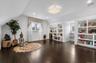 Sitting room featuring lofted ceiling, dark wood-style floors, recessed lighting, a chandelier, and built in features