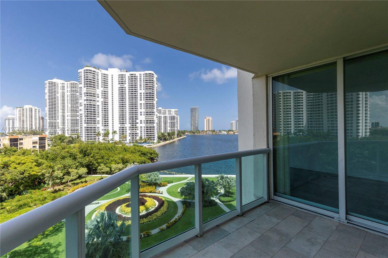 Spacious and bright floorplan unit with three balconies and and gorgeous light gray flooring.