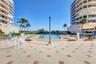 Grand Bay Swimming Pool Area and Barbecue. New Patio Furniture, Lounge Chairs, Sofa's, Umbrellas and Barbecue Area