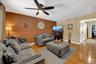 Living room in 3 BR apt. with original brick accent wall
