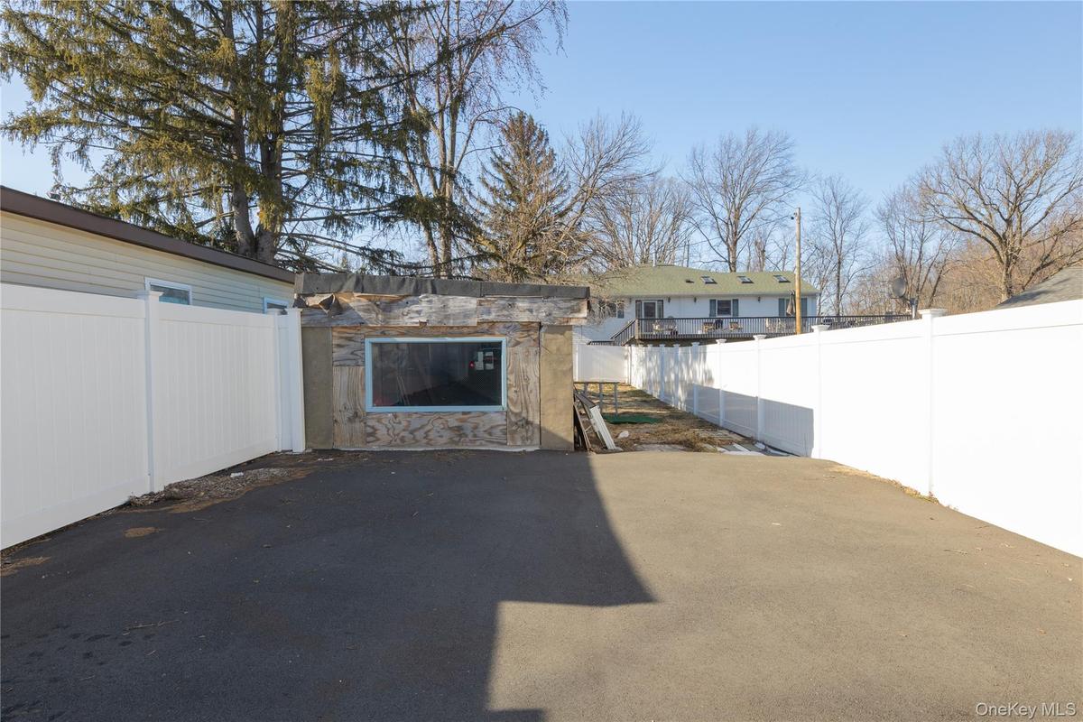 Fenced backyard featuring a patio