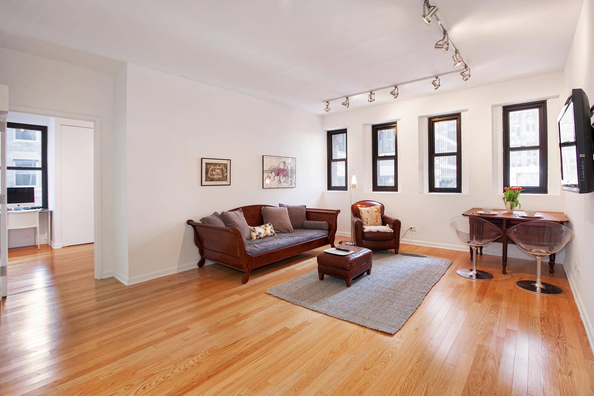 Recently updated loft like one bedroom condominium with both South and East exposures in landmarked 56 Pine Street.