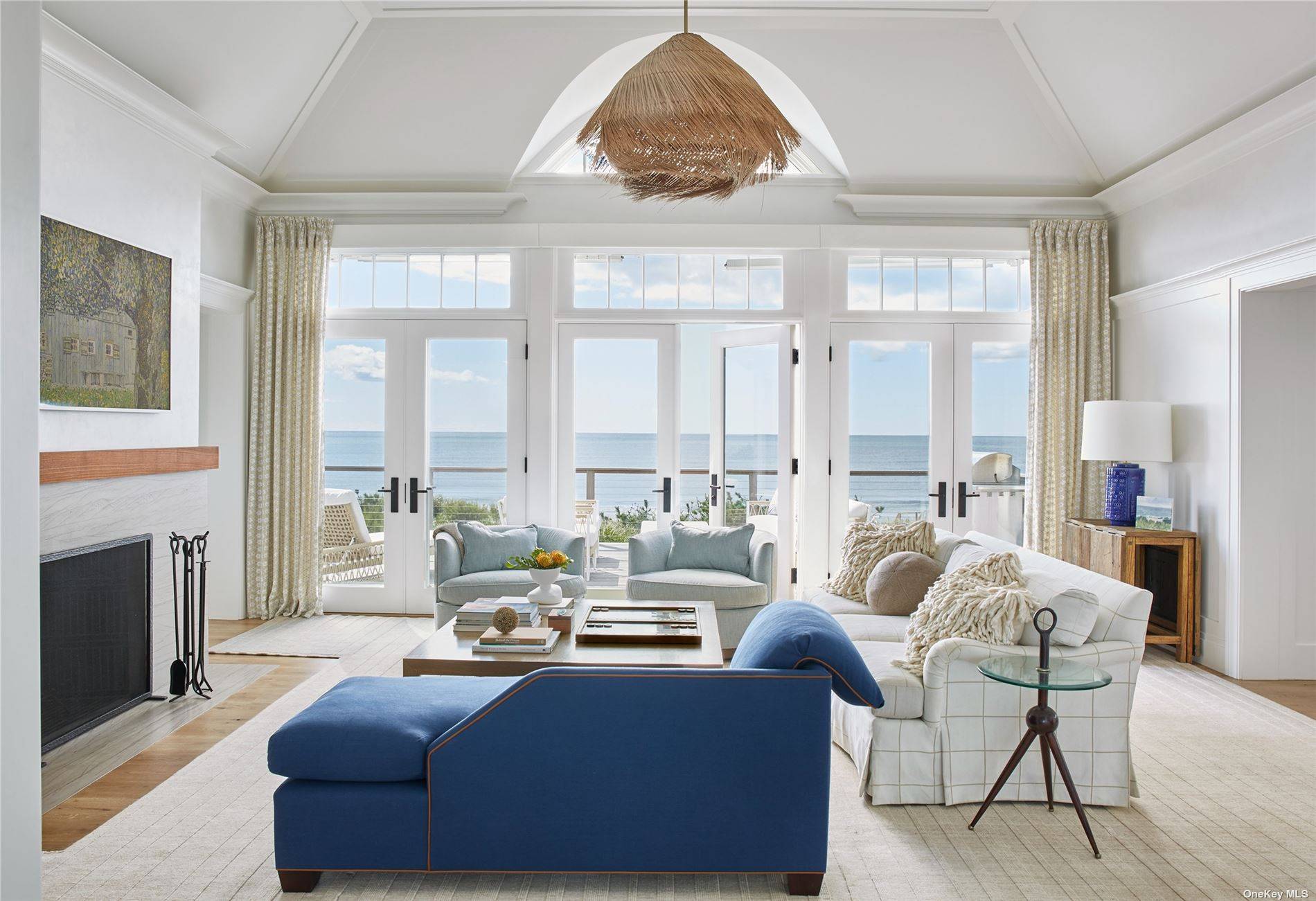 Escape to summer bliss at this exquisite new construction, oceanfront home in Quogue, offering unrivaled vistas of the ocean and bay.