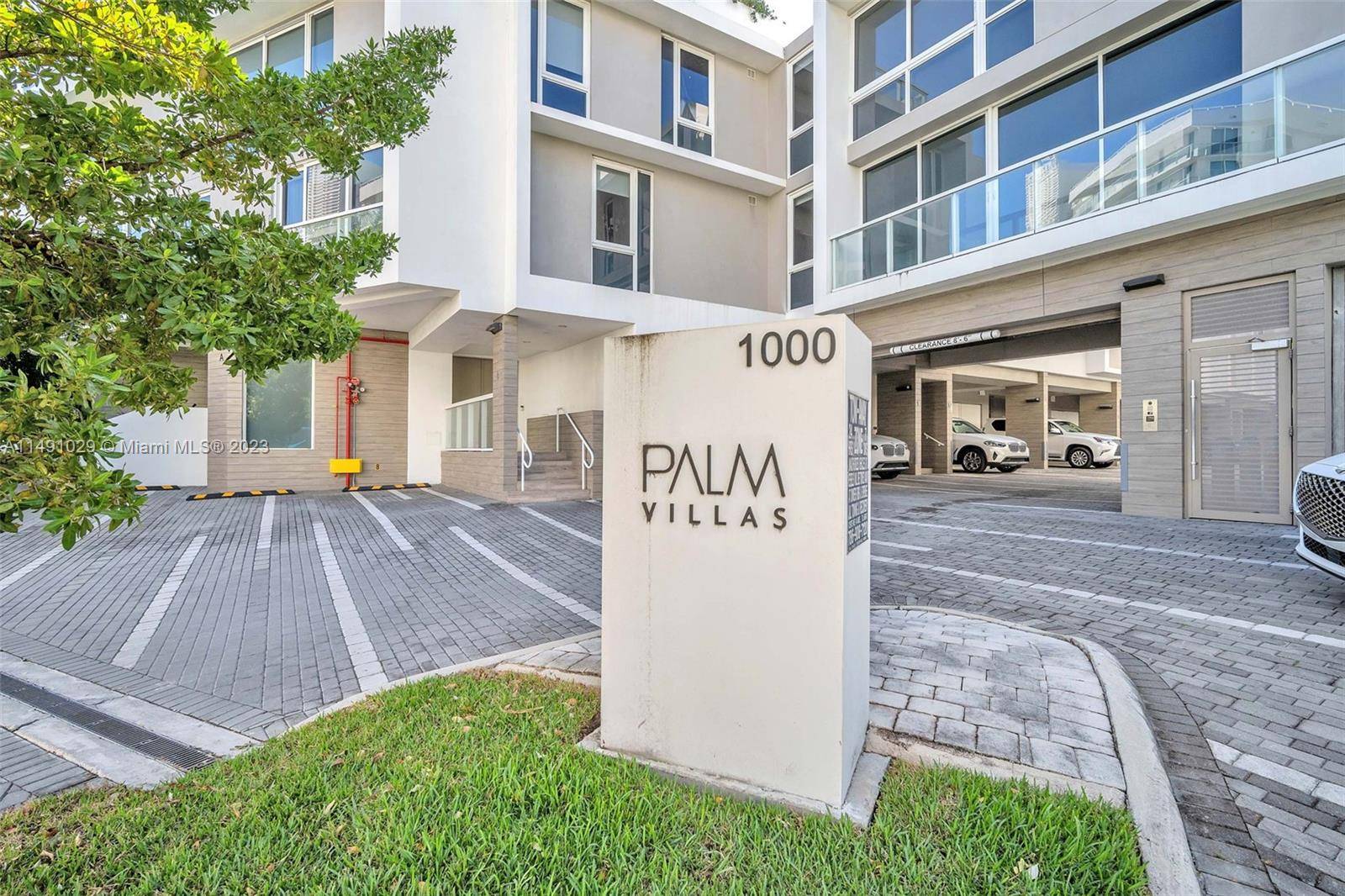 Live luxuriously at PALM VILLAS, Bay Harbor Islands, steps from the beach.