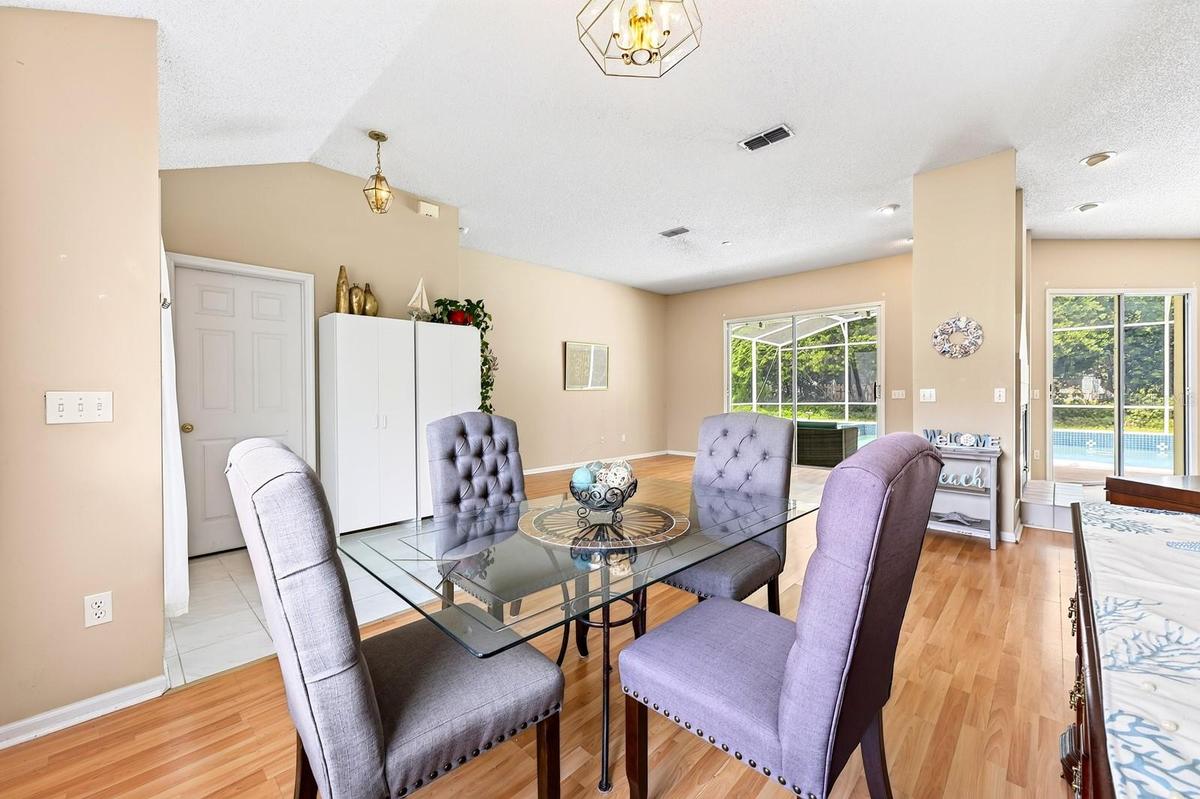 The separate Dining Room is tucked just off the foyer and features a CHARMING ARCHED front-facing window.