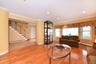 Living room featuring baseboard heating and a healthy amount of sunlight