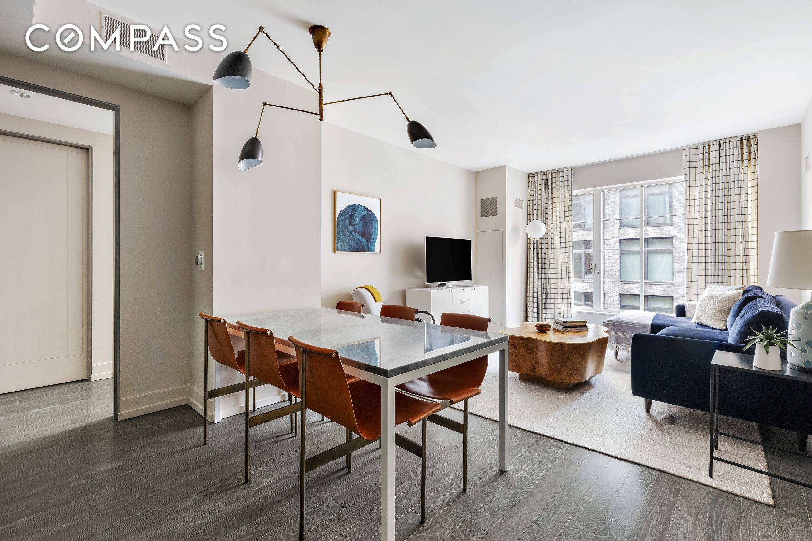 Perched high on the 11th floor of luxurious 70 Charlton, is picture perfect 11E, a winged two bedroom two bath residence in the heart of Hudson Square.