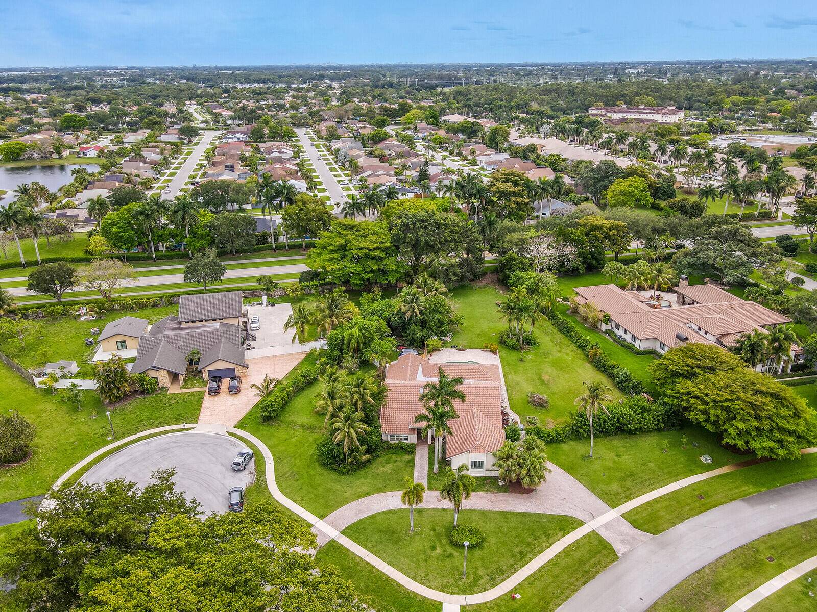 11808 Greystone Drive is an unparalleled gem nestled in the prestigious enclave of Winding Lakes II in Logger's Run, Boca Raton.