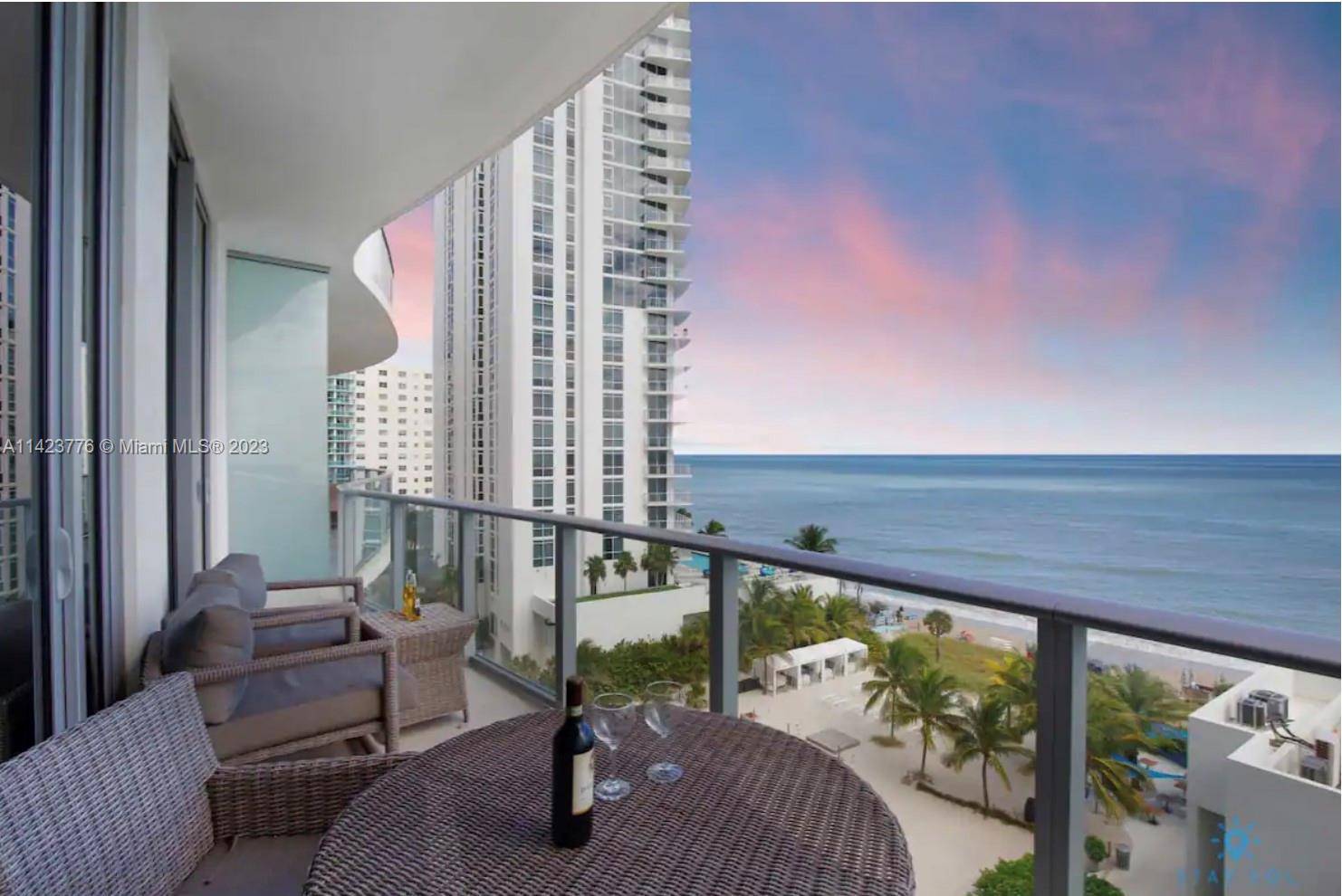 Embrace coastal living in unparalleled luxury with this rare oceanfront corner unit !