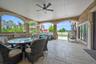 View of patio with a ceiling fan and outdoor dining area
