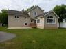 Back view of home w/Patio