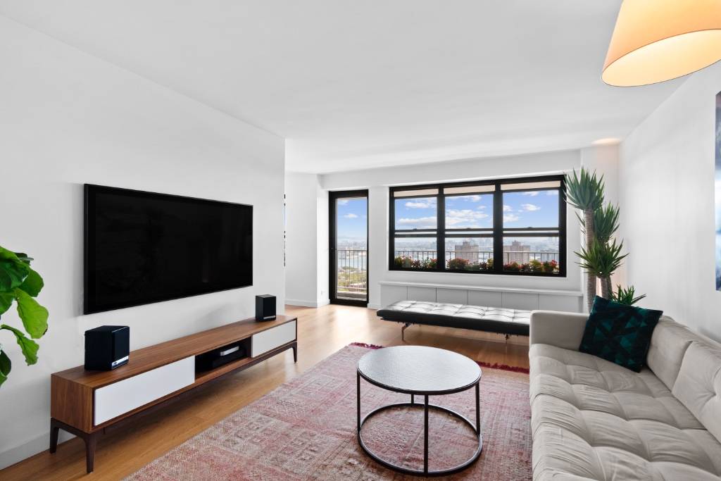 Situated on the penthouse floor of 268 East Broadway, Apartment 2006 is a coveted, oversized, and recently gut renovated 2023, true one bedroom with private outdoor space, ample natural light, ...