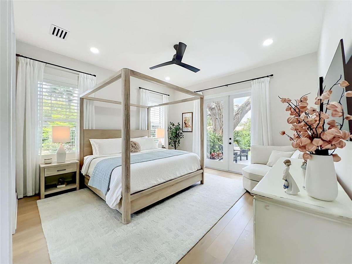 Primary Bedroom with french doors onto private patio and deck