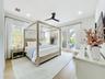 Primary Bedroom with french doors onto private patio and deck