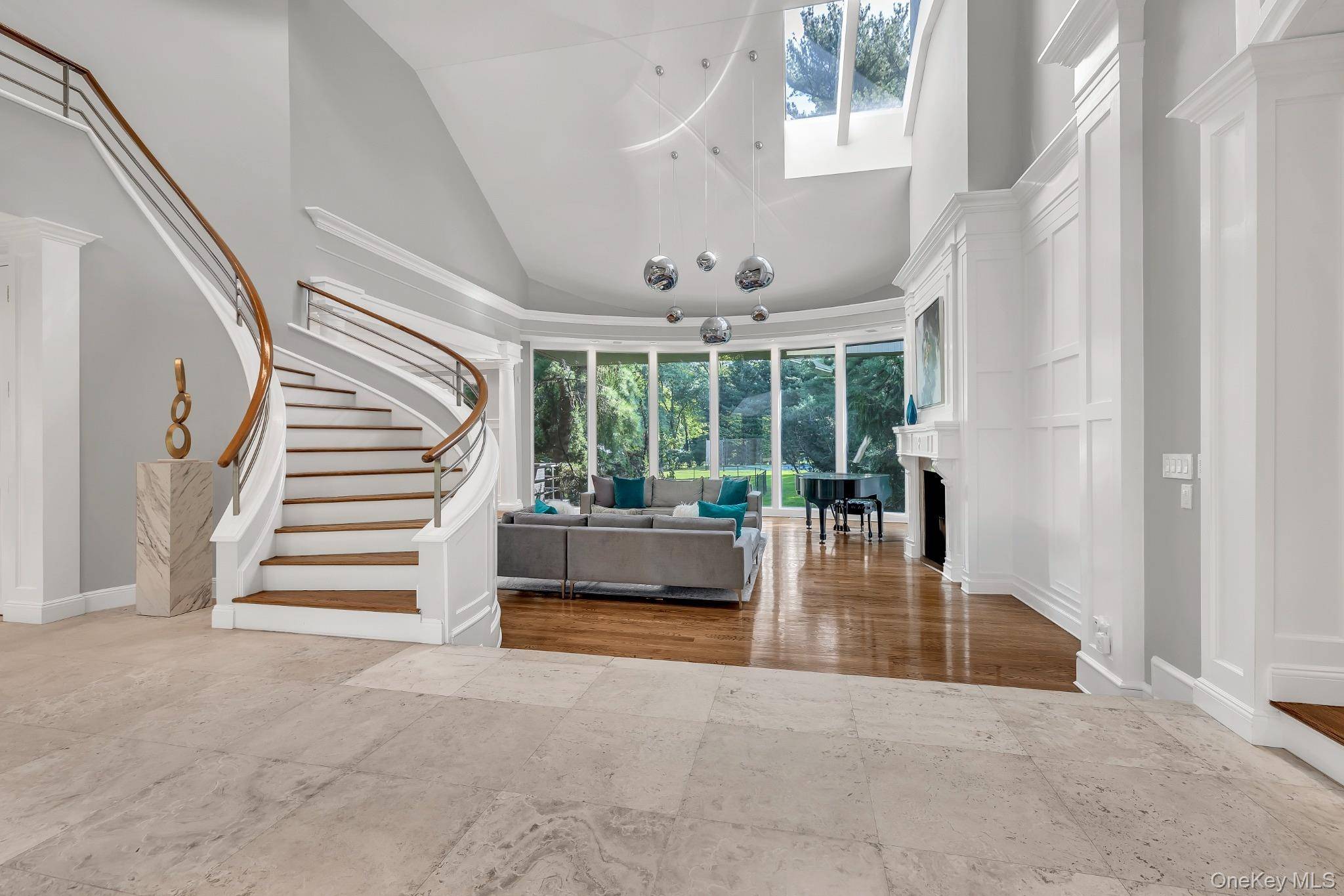 Set on 2 lush acres in the prestigious enclave of Old Westbury, this fully renovated residence combines modern luxury with timeless elegance.