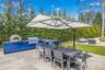 Shaded dining with pizza oven & grill