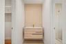 Bathroom with vanity, a stall shower, wood finished floors, and a walk in closet