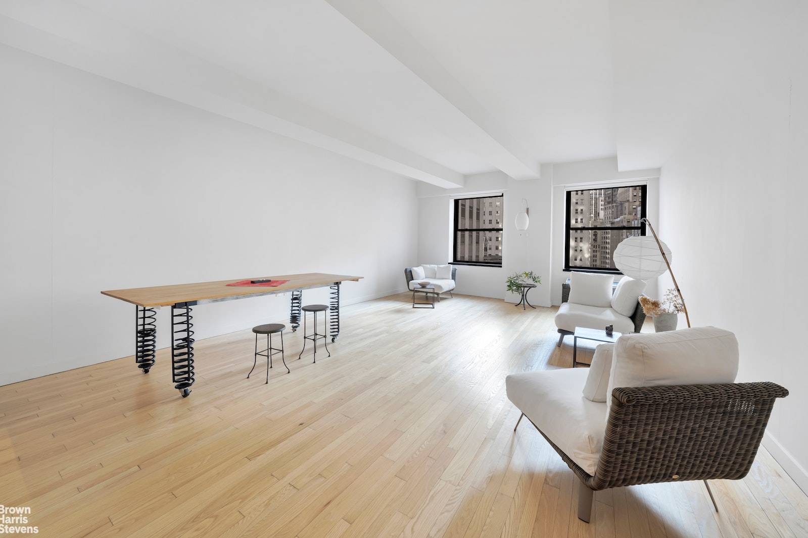 Welcome to Apartment 1506 at the exquisite 20 Pine Street, a quintessential slice of New York real estate nestled within the vibrant heart of the Financial District.