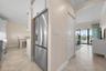 Remodeled kitchen with stainless appliances and in unit washer and dryer