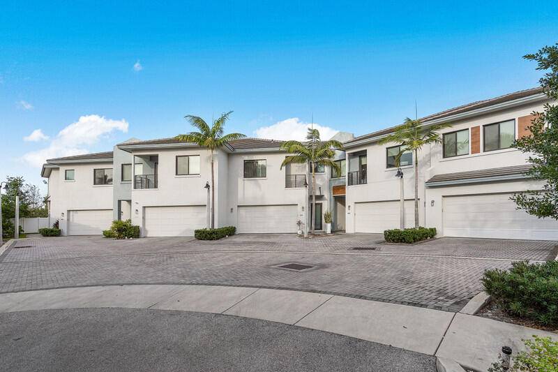 Introducing a modern and inviting newer construction townhome Dec 2020 in the heart of Tropic Isles of East Delray Beach.