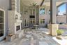 Large outdoor covered patio with wood burning fireplace
