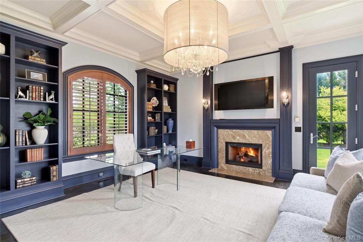 Built-in Book Shelves | Gas Mantled Fireplace