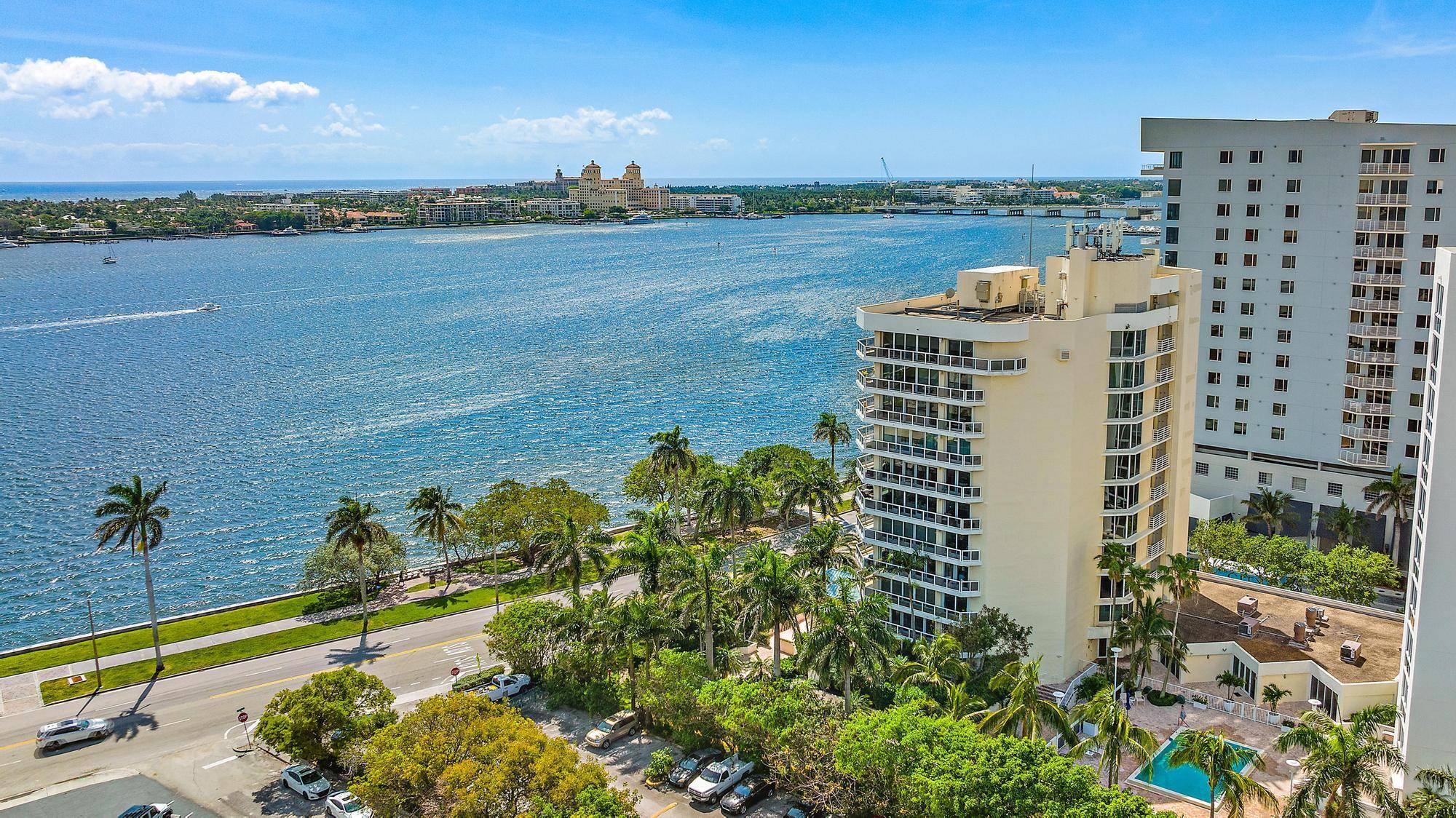 Designer furnishings, professionally decorated interiors, 100 feet of floor to ceiling glass and glorious views of the intracoastal waterway and Palm Beach awaits in this light and bright sprawling apartment.