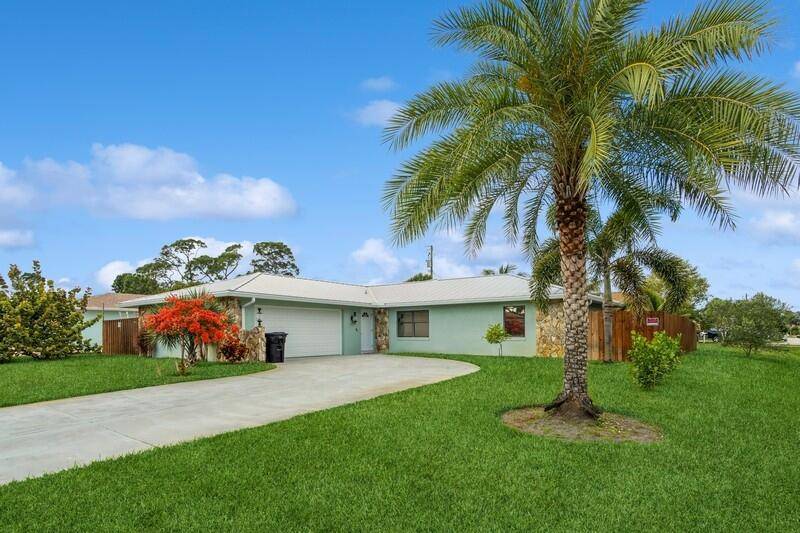 Sparkling 3 Bedroom, 2. 1 Bath, CBS Home with a Newer Standing Seam Metal Roof 2019 located on an Oversized Corner Lot in the Sandpiper Bay Area.