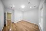 Unfurnished bedroom with light wood-type flooring, recessed lighting, and a closet