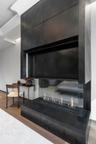 Details with an outdoor fire pit and wood finished floors