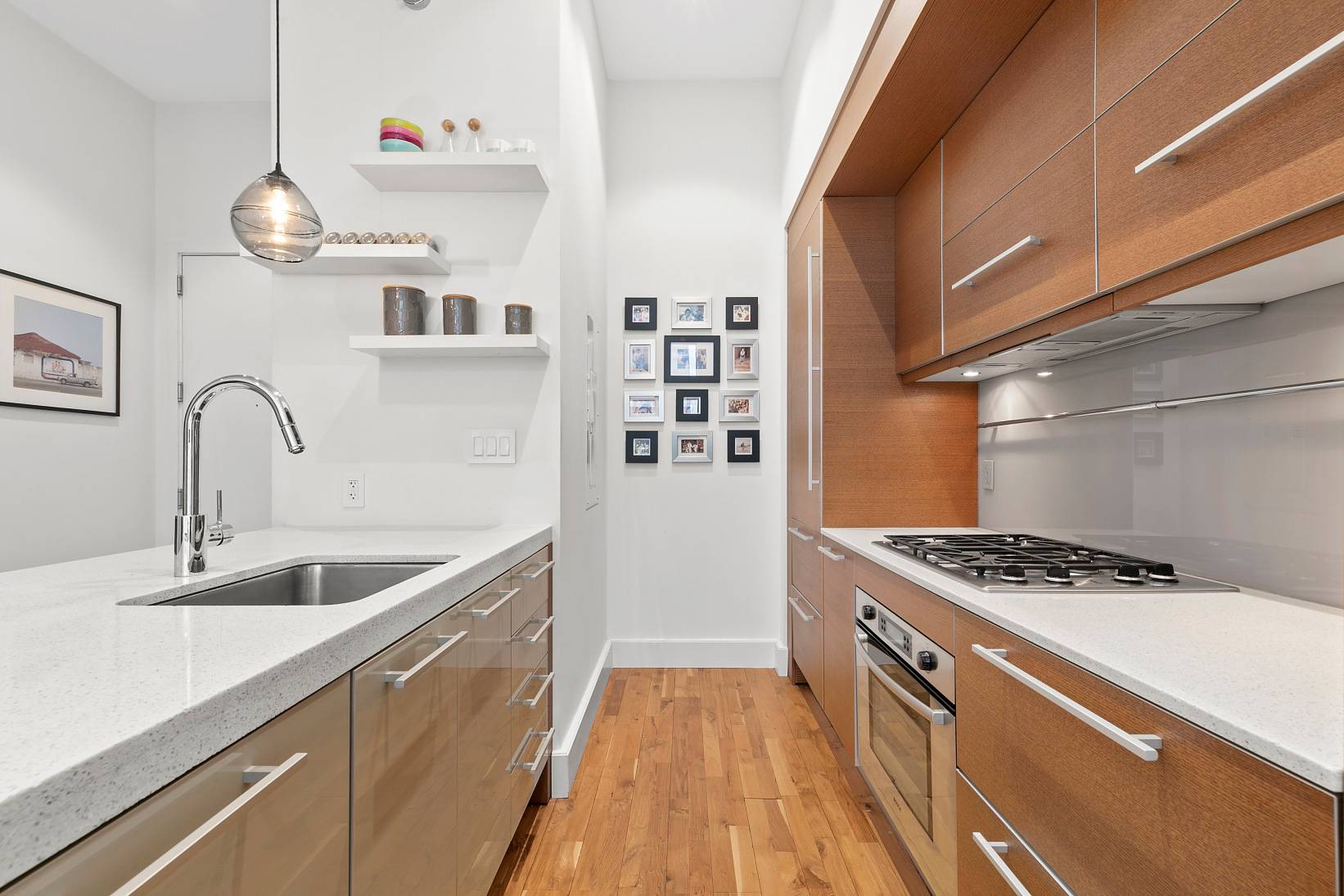 This home features a wall of windows in the living room with southern sunlight, a large walk in closet, chef's kitchen with dishwasher, vented hood, garbage disposal and Sub Zero ...