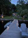 Dock featuring a yard and a water view