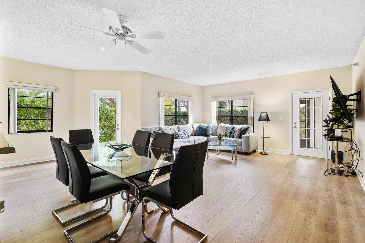 Rare opportunity with this 2 2 renovated corner residence with a one car garage within Boca Pointe.