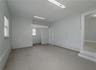 Flex space (400 sqft) with high ceilings, private exterior entrance/exit, and sink/plumbing.