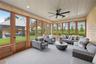 Sunroom / solarium with outdoor lounge area and ceiling fan