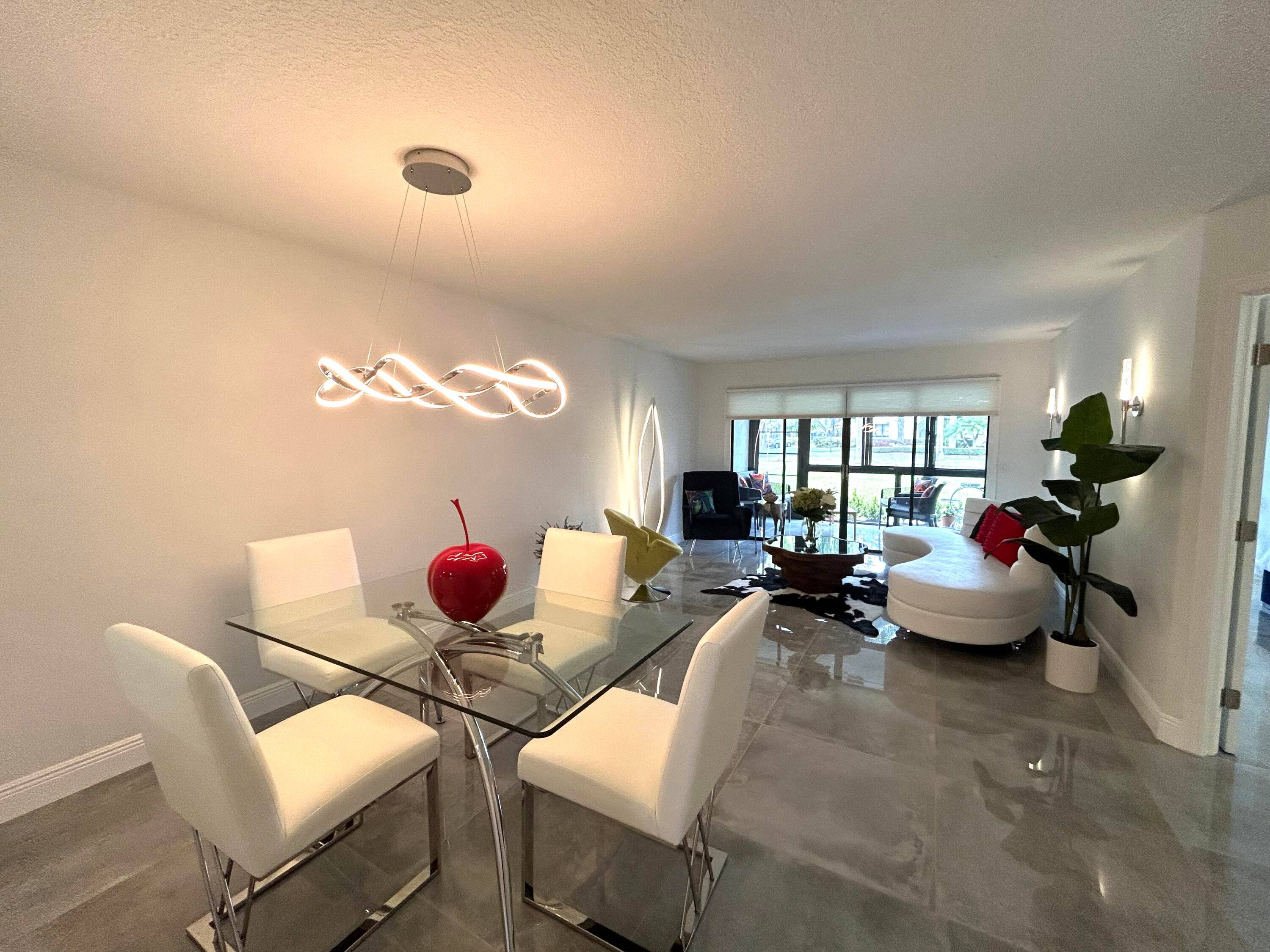 Meticulously renovated from floor to ceiling, This 2 bed 2 bath, 1st floor condo has 36 inch tiles throughout, filled with natural light and feels exceptionally open and airy.