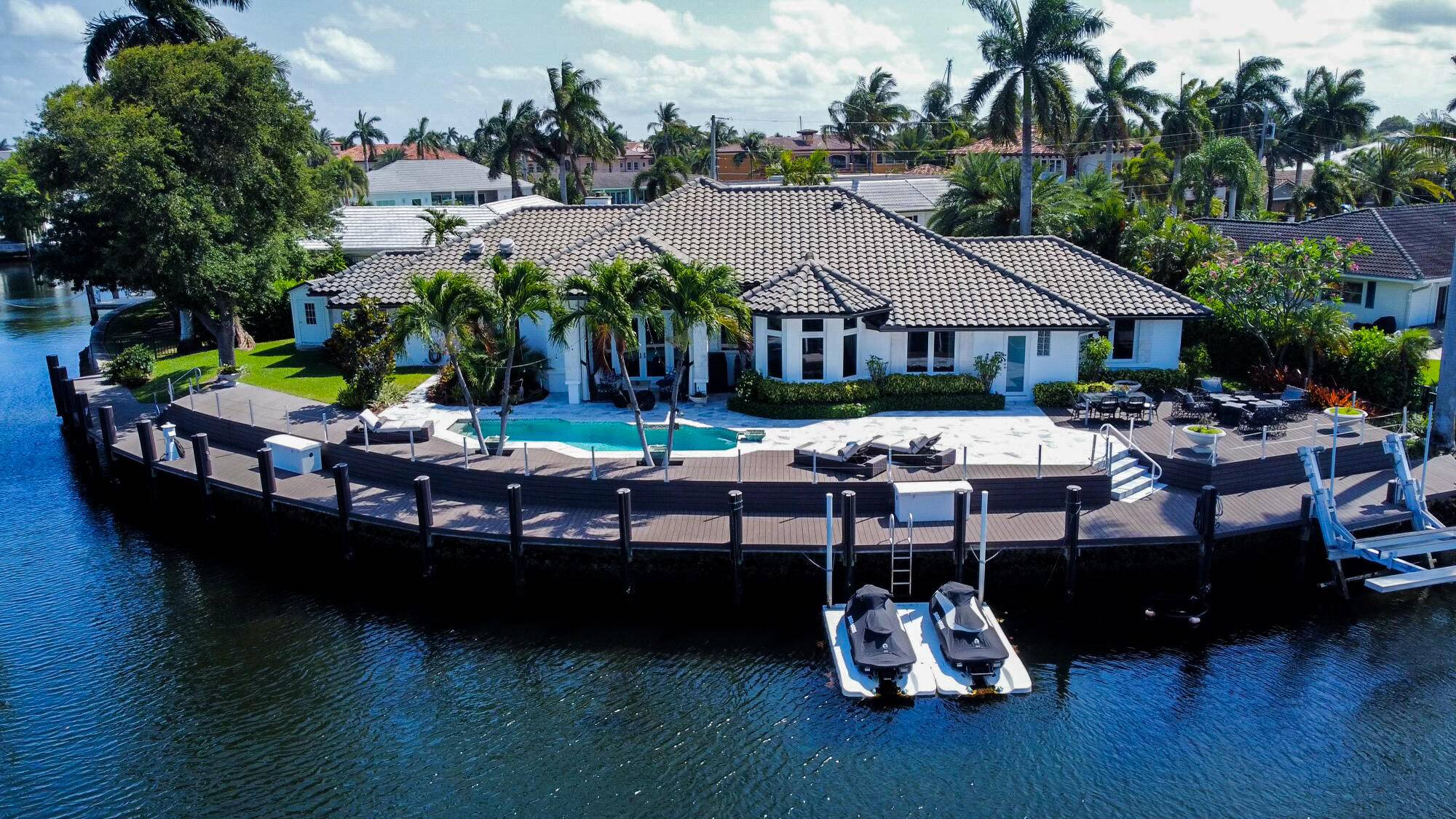 The Quintessential Estate for the Yachting Enthusiast sited on a Premier Point Lot with over 200' of waterfrontage on the Cap Knight Bayou Canal !