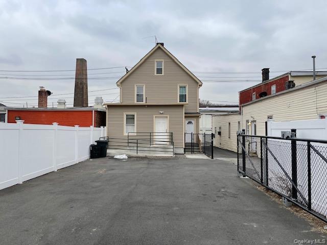 Back of house with a patio area