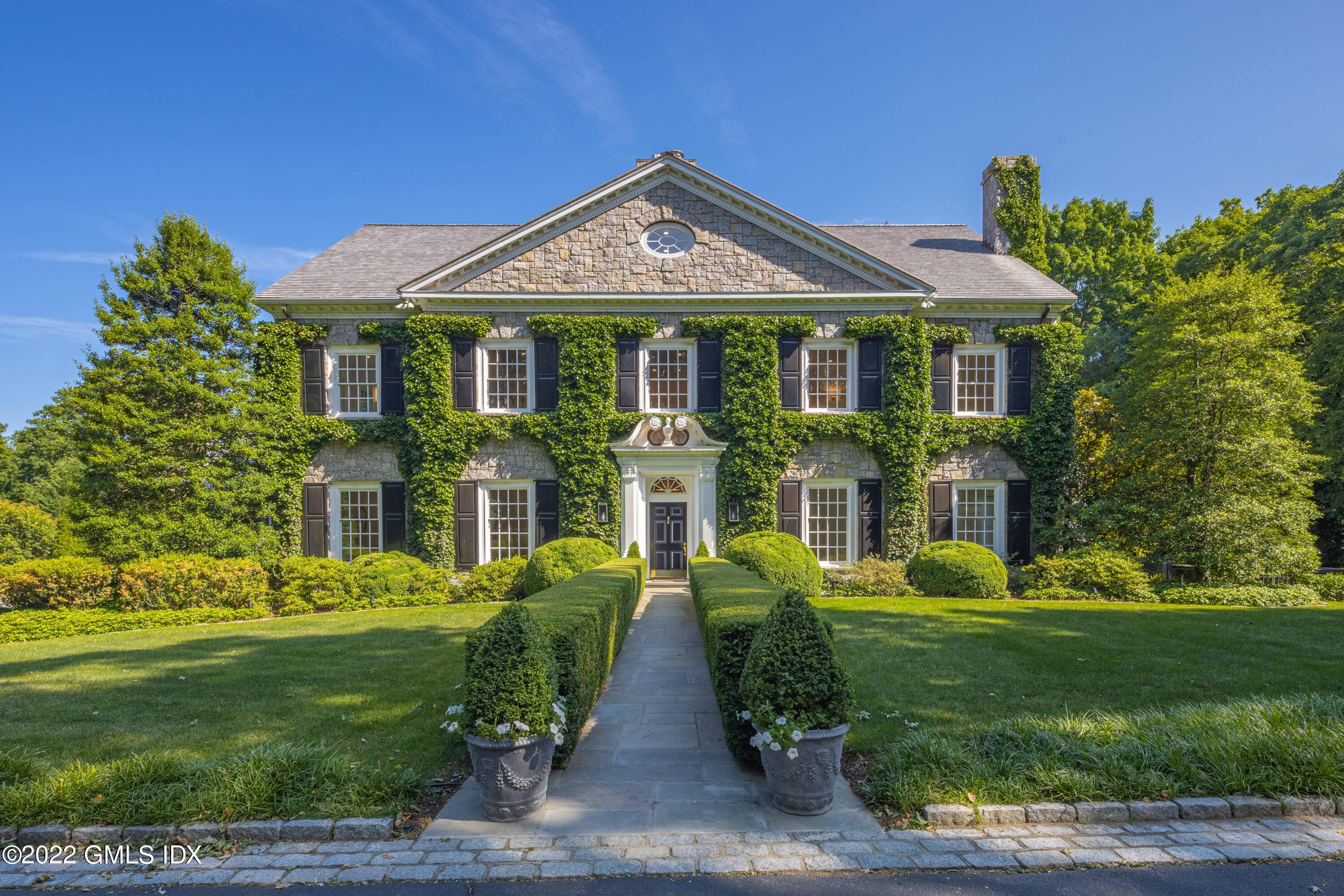 Deer Park. Magnificent and newly renovated stone and clapboard Georgian at end of quiet lane on 3 acres in coveted Deer Park.