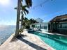 Resort style backyard with sparkling pool, spa, and room to entertain
