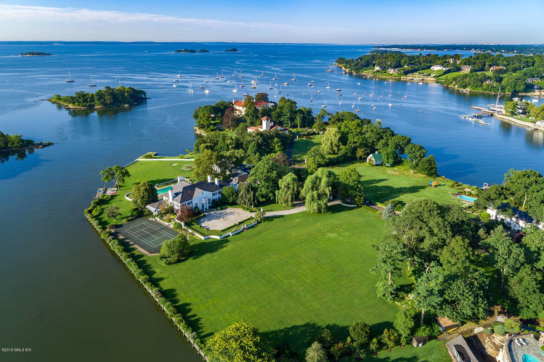 In the exclusive guard gated Indian Harbor association, this rare Long Island Sound compound is one of Greenwich's most significant waterfront estates.