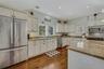 Kitchen featuring lots of cabinetry, granite countertops, stainless steel appliances