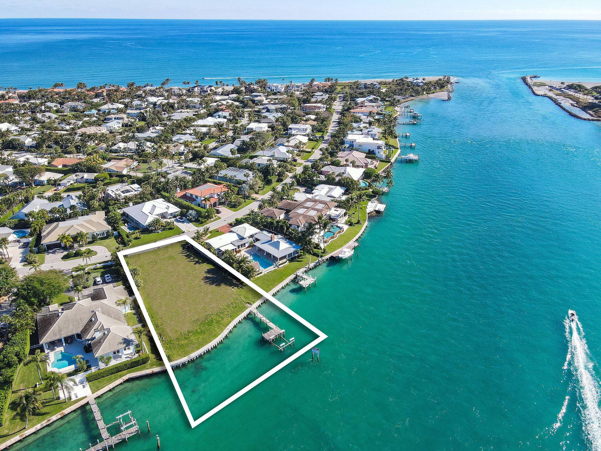 One of the premier waterfront lots on the east coast of FL directly on the blue water where the Jupiter Inlet meets the Intracoastal waterway overlooking the historic Jupiter Lighthouse.