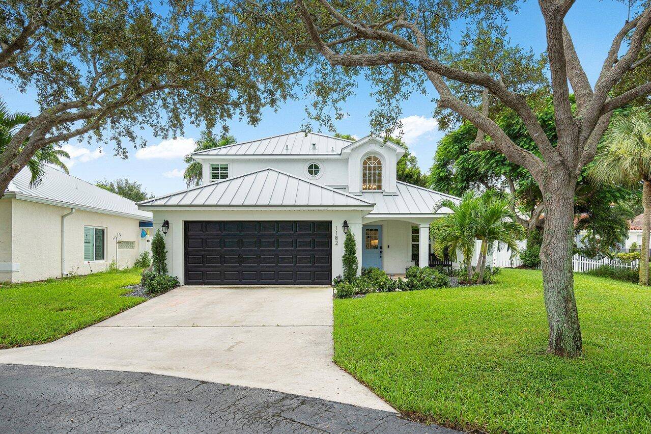 Picture perfect, completely renovated home on a large, private lot in the sought after gated community of Delray Lakes.