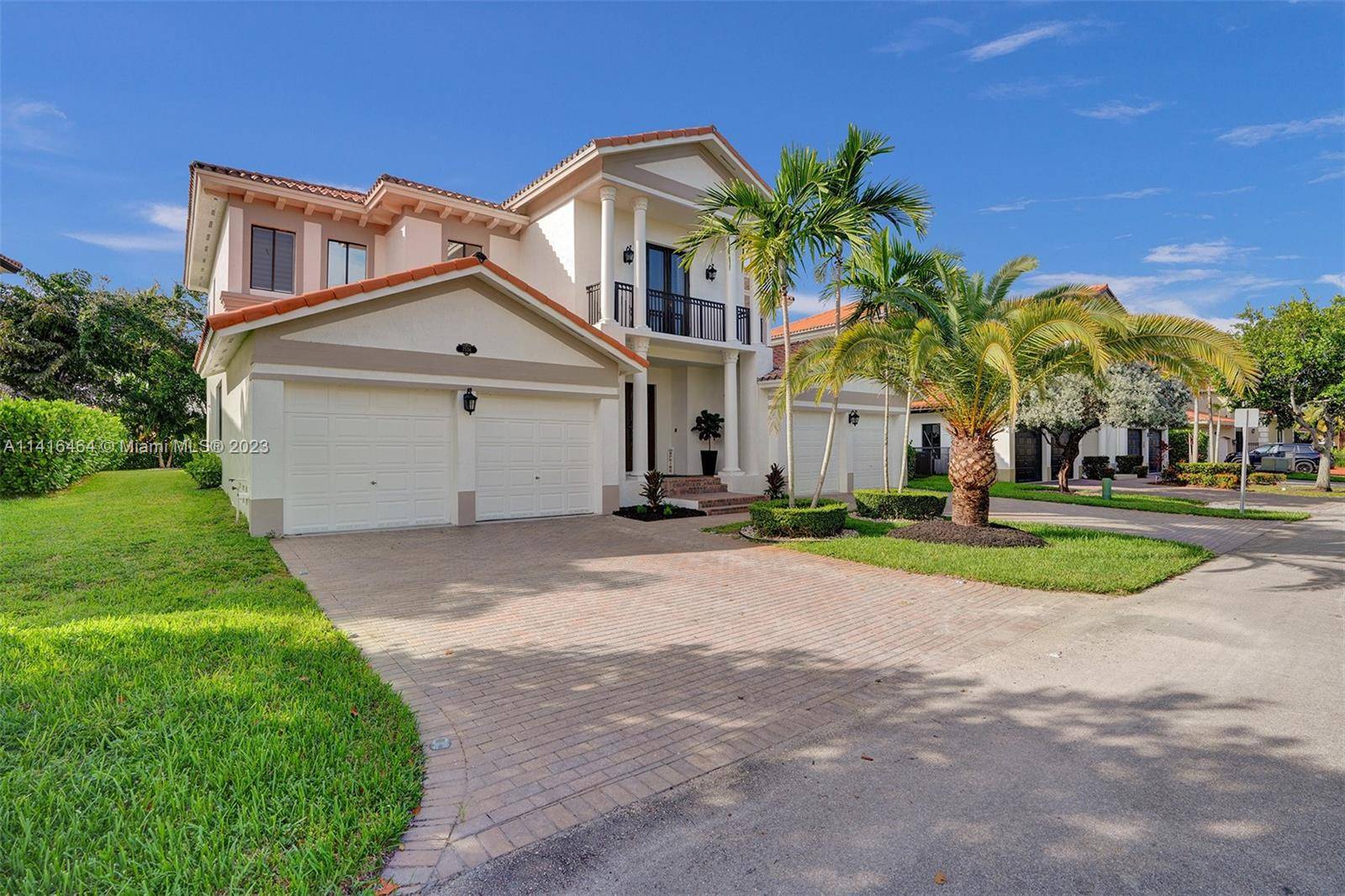This stunning 2 story home is located in the prestigious guarded community of Cutler Cay.