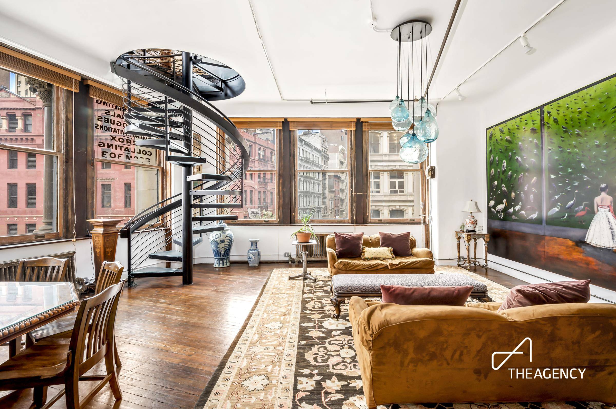 This unique corner loft in the iconic MacIntyre Building boasts ample natural light streaming through 18 oversized South and West facing windows, offering a picturesque view of the cityscape and ...