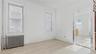 Empty room with radiator and light wood-style flooring