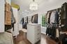 Primary Walk in closet w/ W/D