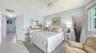 The primary suite is turnkey furnished, like the rest of the condo