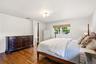 Gleaming wood floors are found in the Primary Suite.